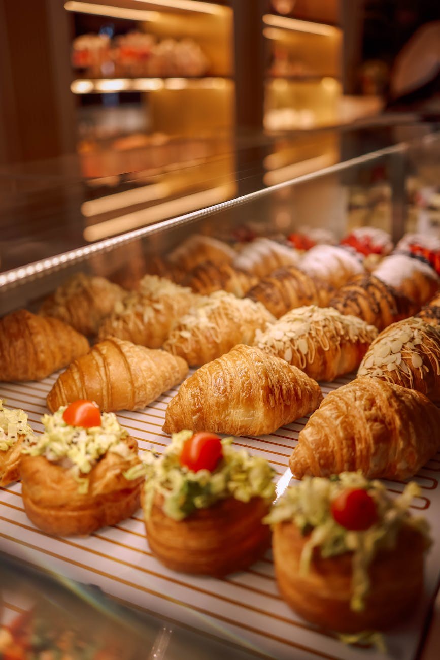 Close-up of beautifully arranged pastries in display case